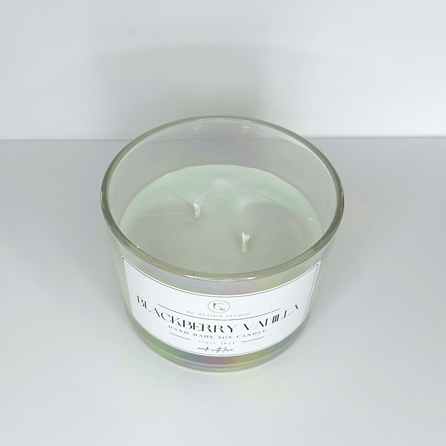 Close-up of the 16oz Blackberry & Vanilla Buttercream Candle highlighting the natural soy wax and eco-friendly wick.