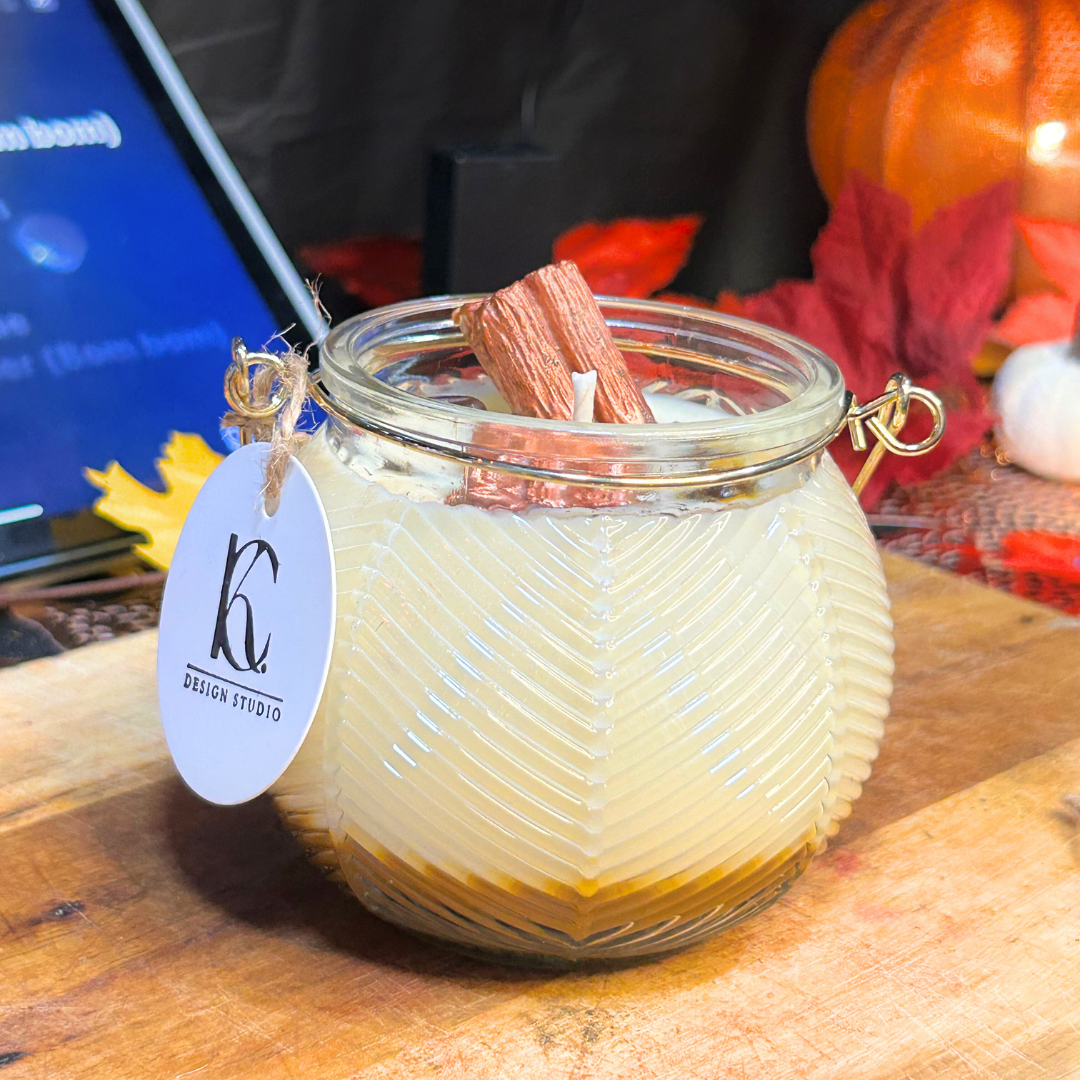 Side view of Autumn Roast Candle – layered cappuccino espresso and marshmallow soy wax candle with cinnamon stick, brown flower, two coffee beans, and brown mica powder, cozy fall vibes.