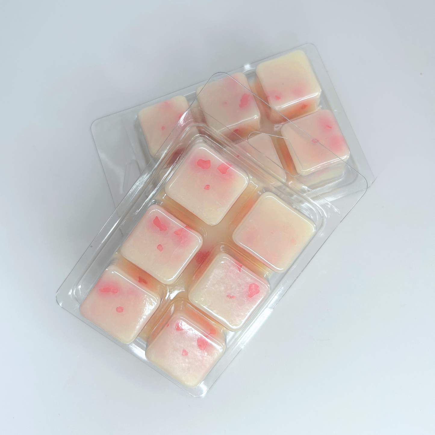 Close-up of the Blossom Sea wax melt, highlighting intricate cherry blossom wax flowers and the Baja Cactus Blossom fragrance blend.