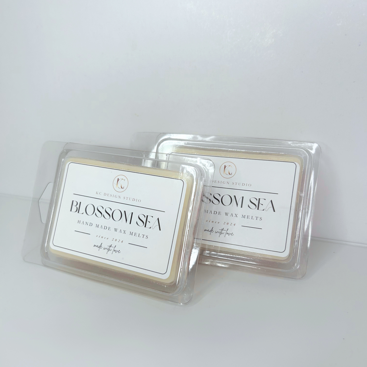 Side view of the Blossom Sea wax melt, showing its smooth, creamy texture and hand-crafted floral design.