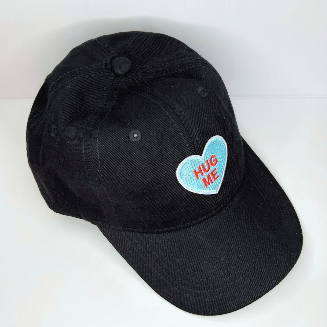Blue Hug Me heart design cotton cap with moisture-wicking fabric and ventilation eyelet for enhanced comfort, ideal for workouts and daily wear.