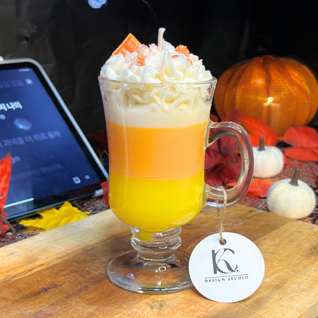 Front view of Candy Corn Candle with three layered scents — vanilla buttercream, lemon sugar cookie, and mandarin cranberry.