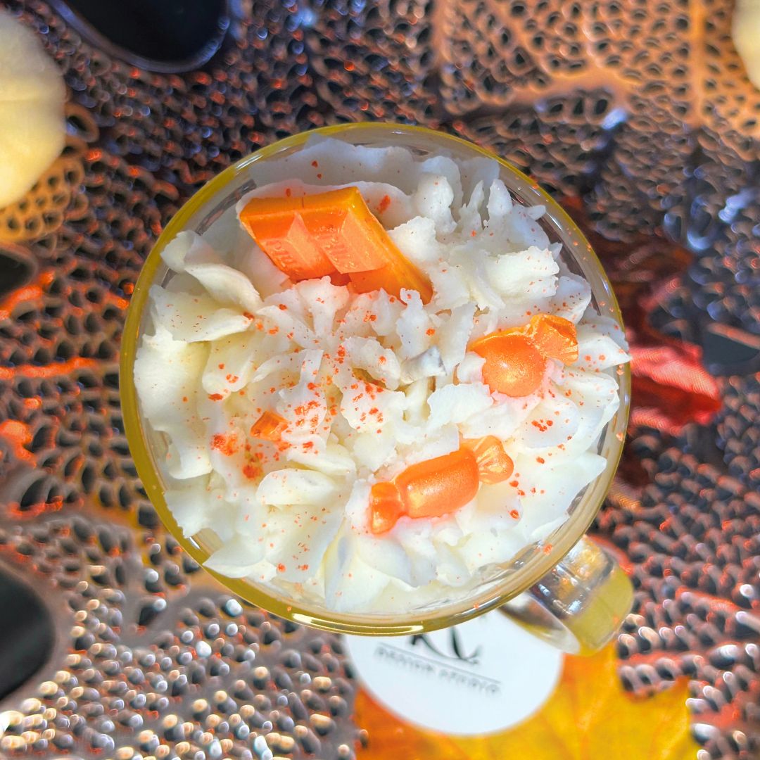 Top view of Candy Corn Candle showing whipped cream design, chocolate bar, and candy topper for a festive Halloween look.