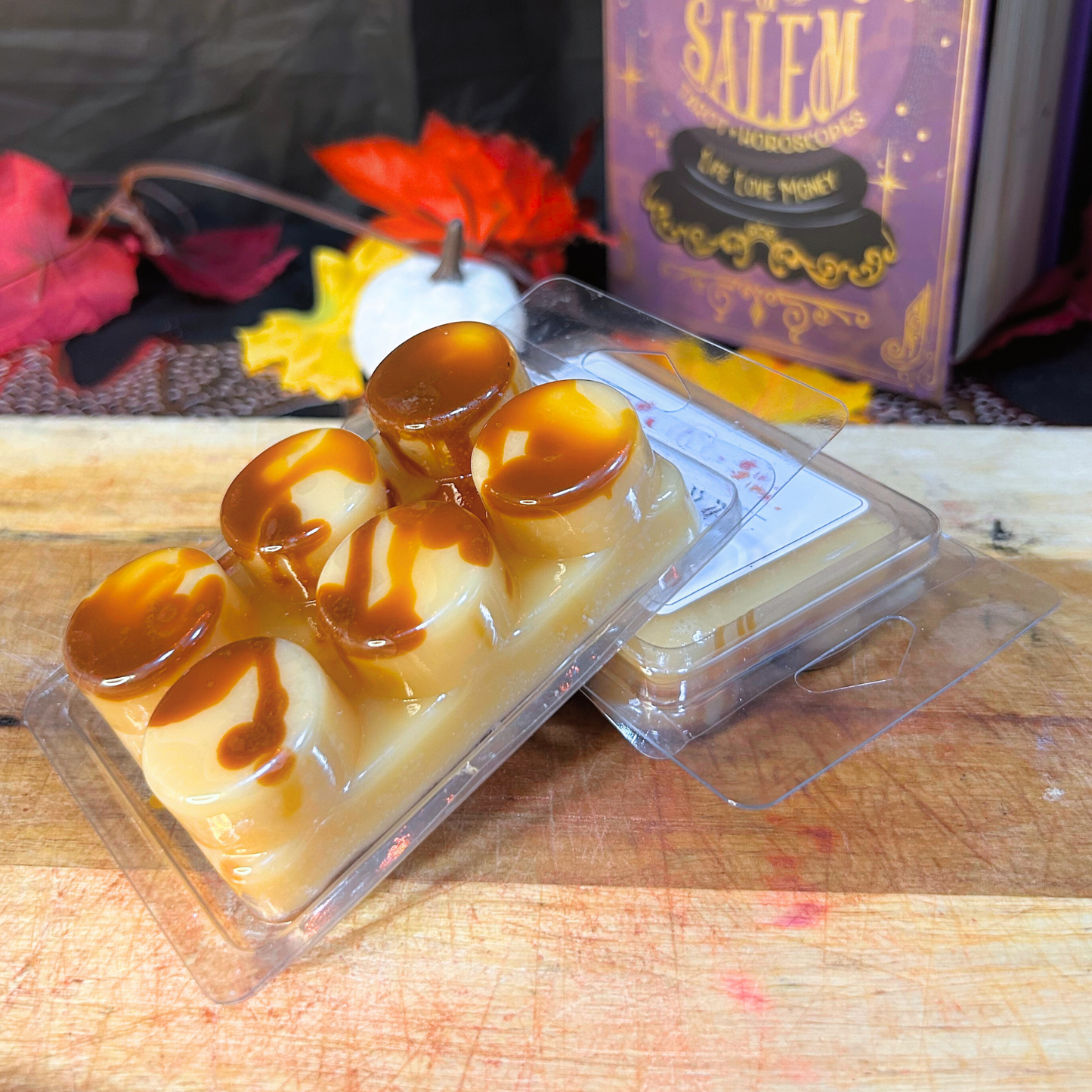 Caramel Honey Wax Melts styled with pumpkins and fall leaves, cozy seasonal home decor aesthetic.