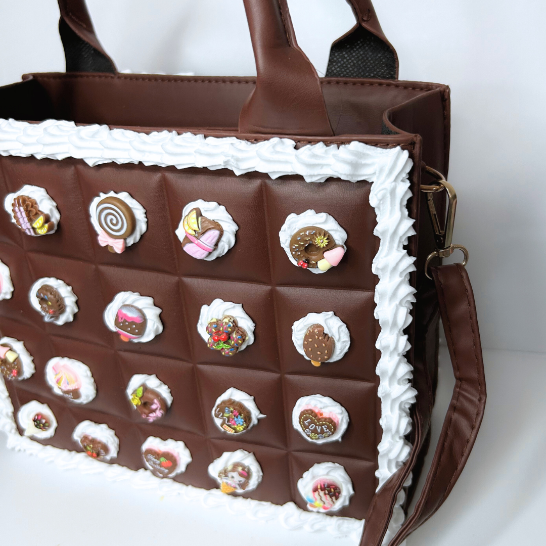 Angled side view showing the shoulder straps and frosting design of the Chocolate Bar Purse.