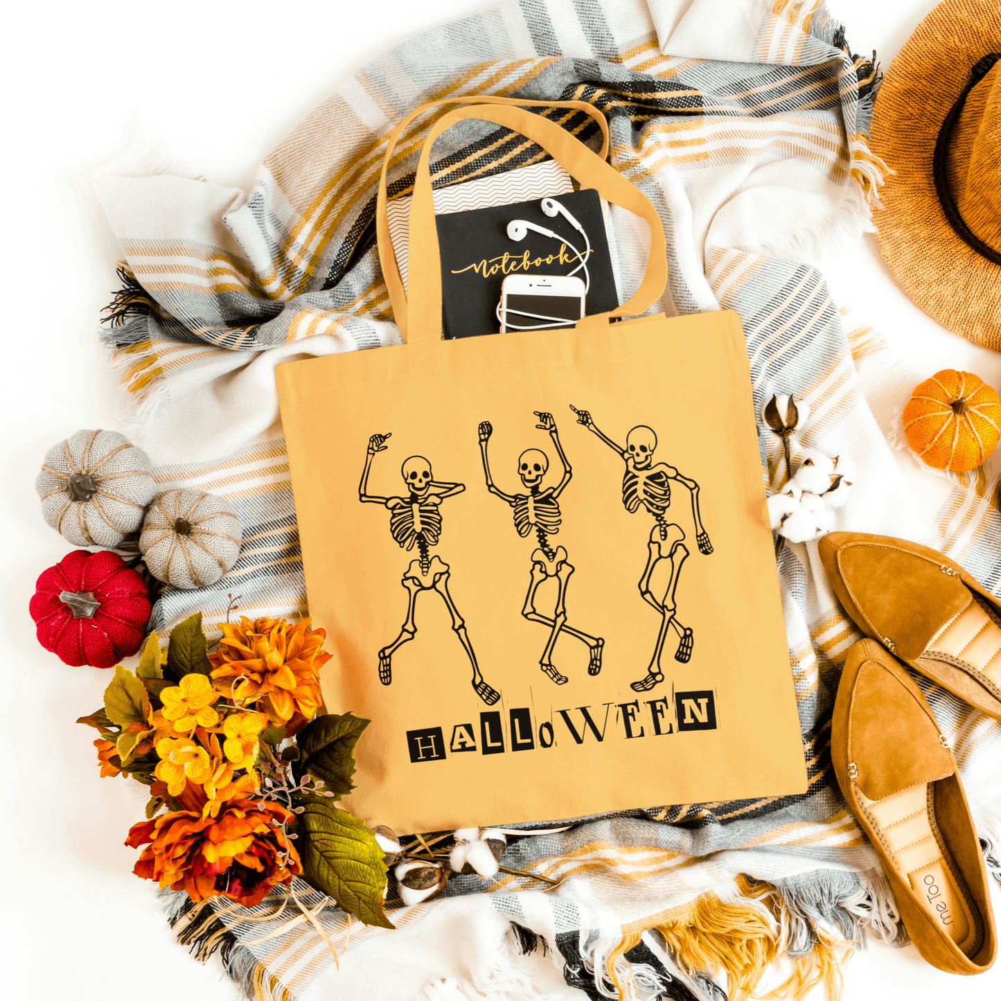 Orange Dancing Skeleton Halloween canvas tote with sturdy handles, great for trick-or-treating and festive events.