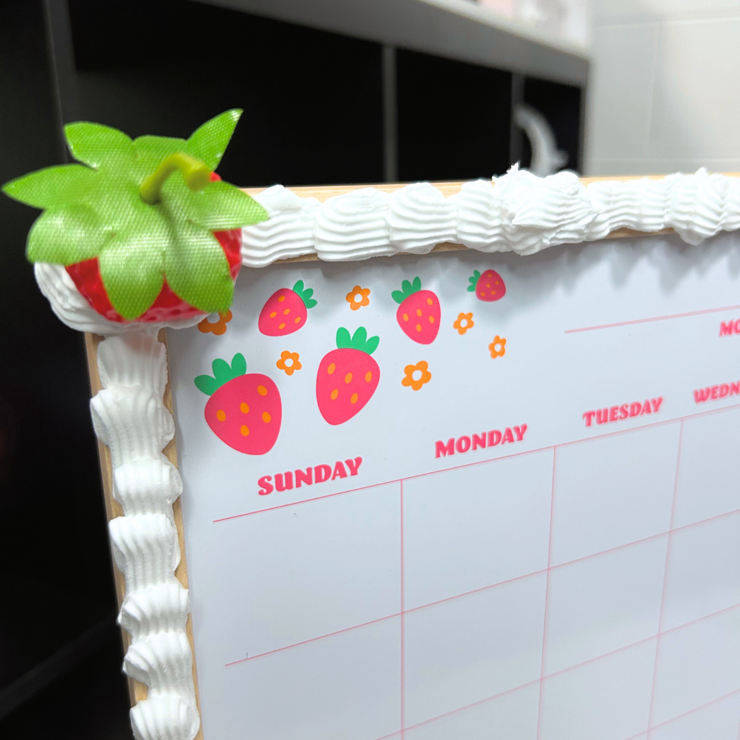 Calendar with strawberry design on a decorative frame