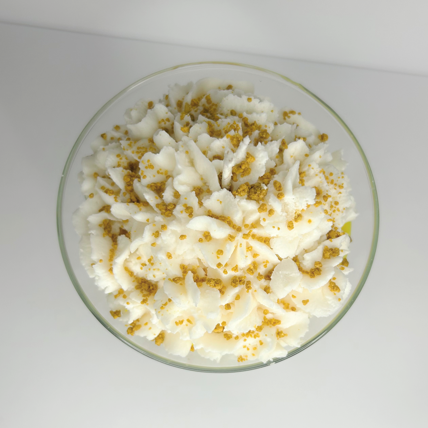Top view of Lemon Meringue Martini Candle with a sprinkle of caramel-scented crumbs on top, showing the blend of vanilla and lemon scents.