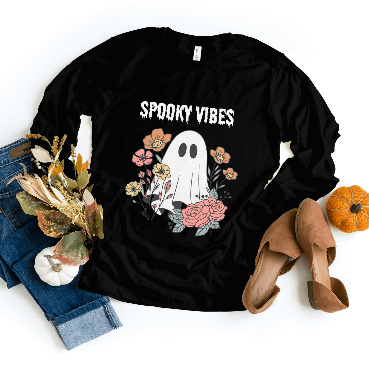 Black Limited Edition Spooky Vibes Sweatshirt showcasing a charming ghost design surrounded by vibrant flowers, ideal for Halloween festivities.