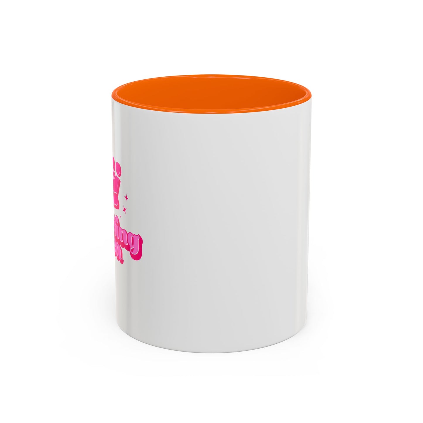 White mug with orange interior and pink text on a white background