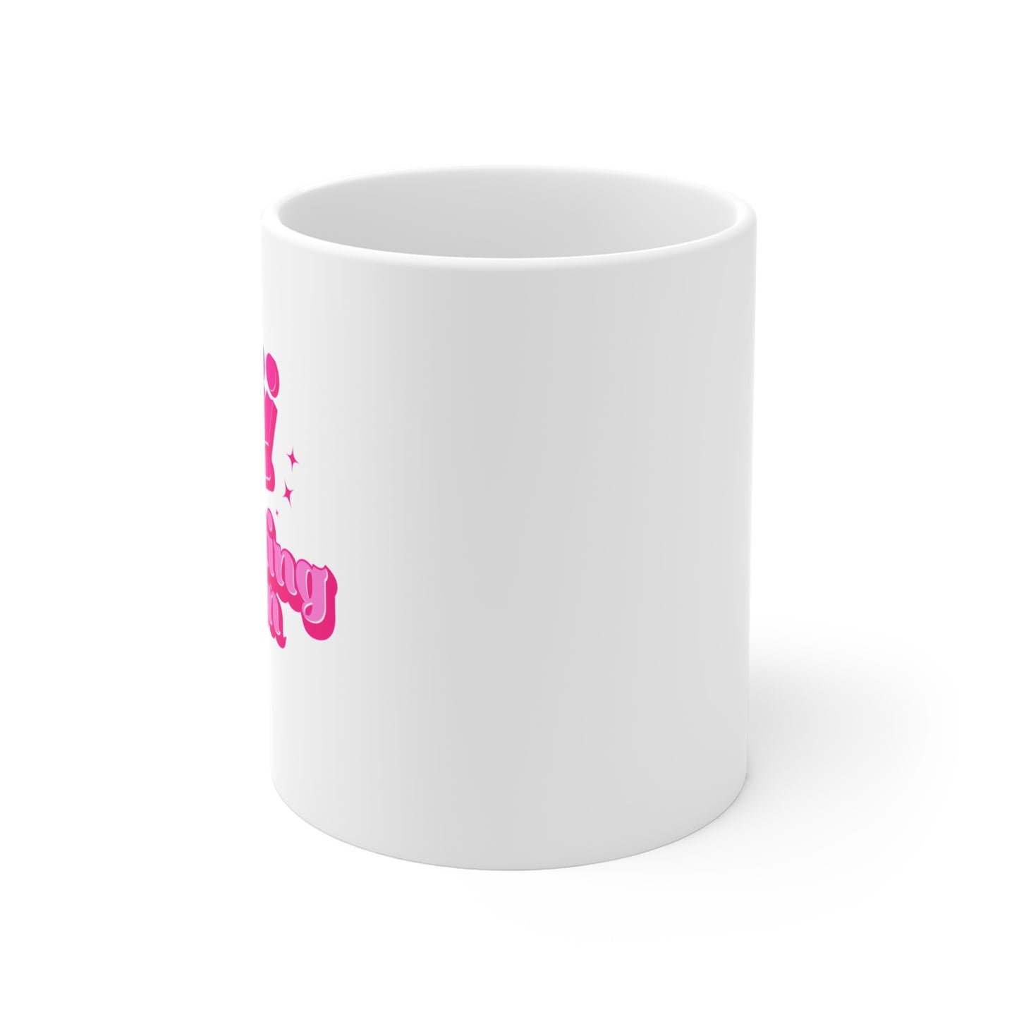 White mug with pink text on a white background