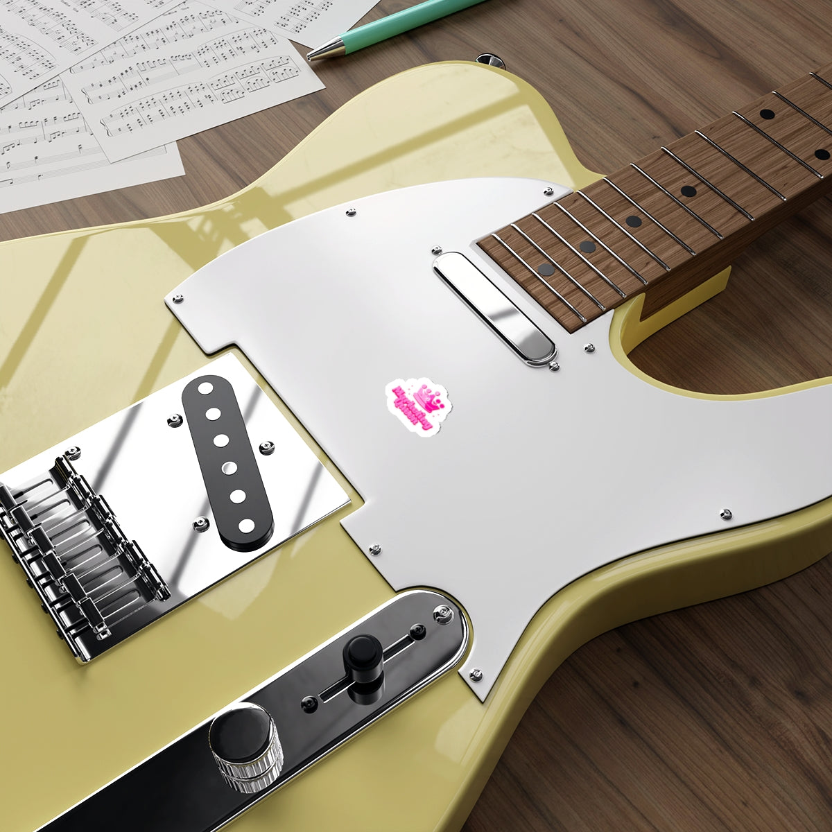 Marketing Queen sticker on a guitar, demonstrating versatility and stylish application.