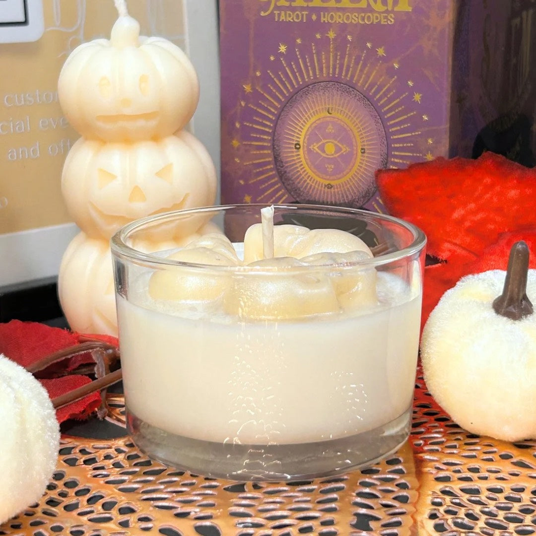 Back view of the Melting Souls Halloween candle featuring three melting skulls, inspired by gothic décor and the Corpse Bride aesthetic.