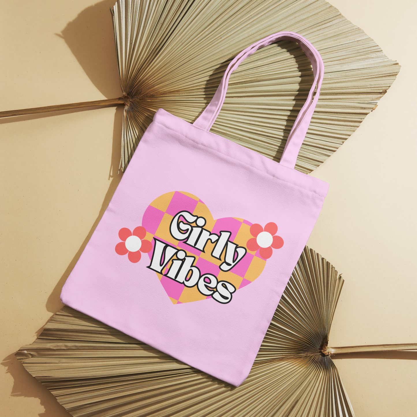 Pink canvas tote bag with a colorful heart and pink flowers, featuring "Girly Vibes" text. Ideal for shopping, school, and more.