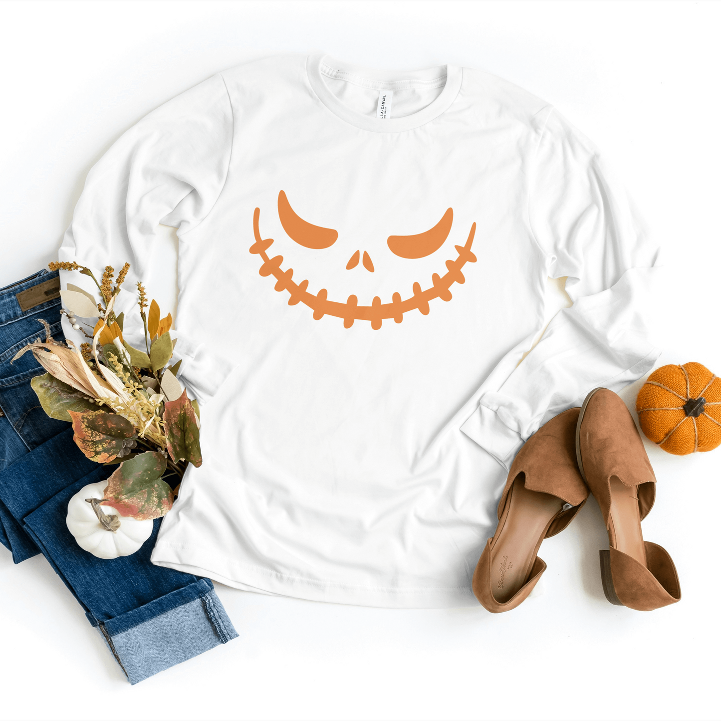 Classic white Pumpkin Face Sweatshirt crafted for comfort and durability, ideal for spooky season celebrations.