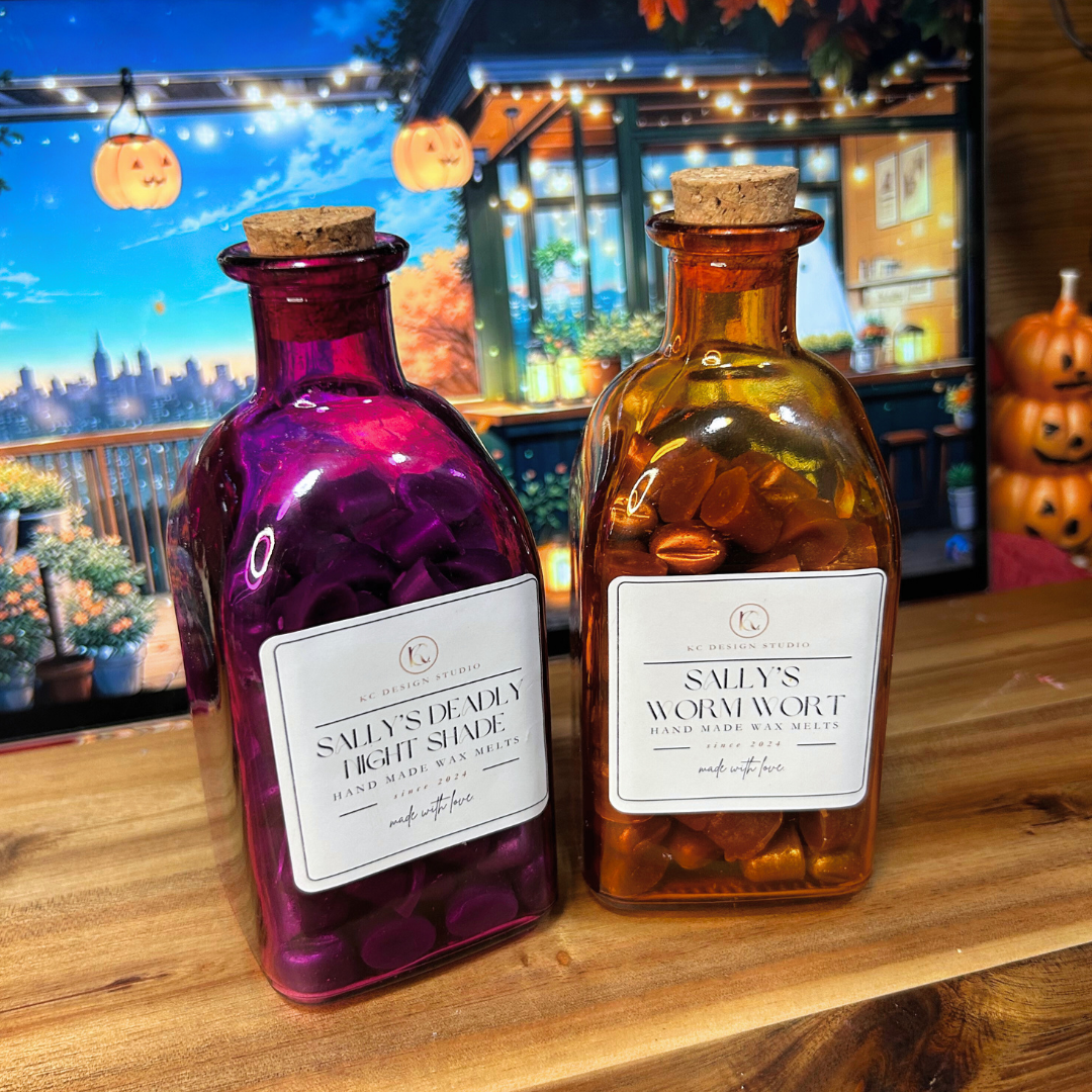 Two potion wax melt bottles on a wooden surface with Halloween decorations in the background.