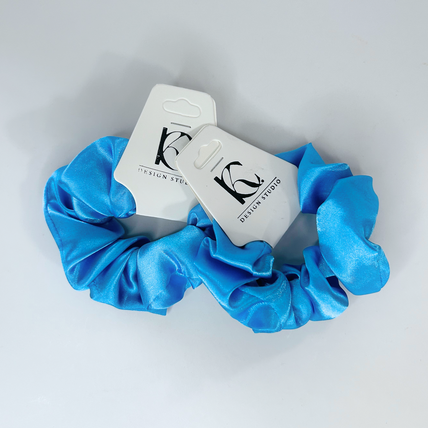 Light sky blue silk scrunchie bringing a refreshing vibe to your look.