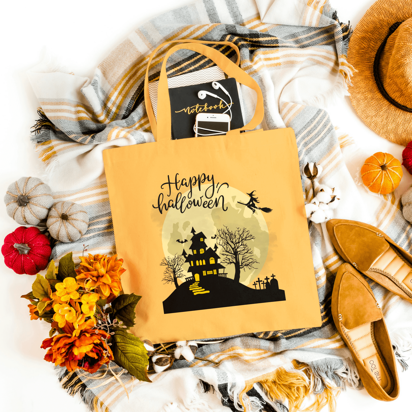 Orange Spooky Haunted House Tote showcasing a haunted house silhouette and 'Happy Halloween' text. Ideal for Halloween parties and everyday use.