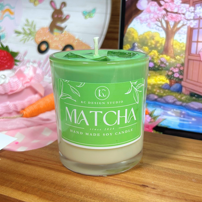 Matcha candle with a green label on a wooden surface, colorful background