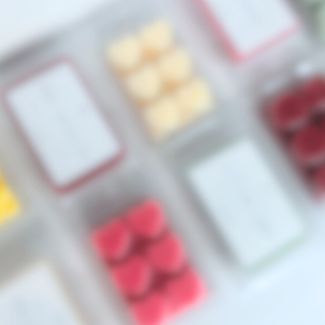 Blurred image of a various wax melts lined up.
