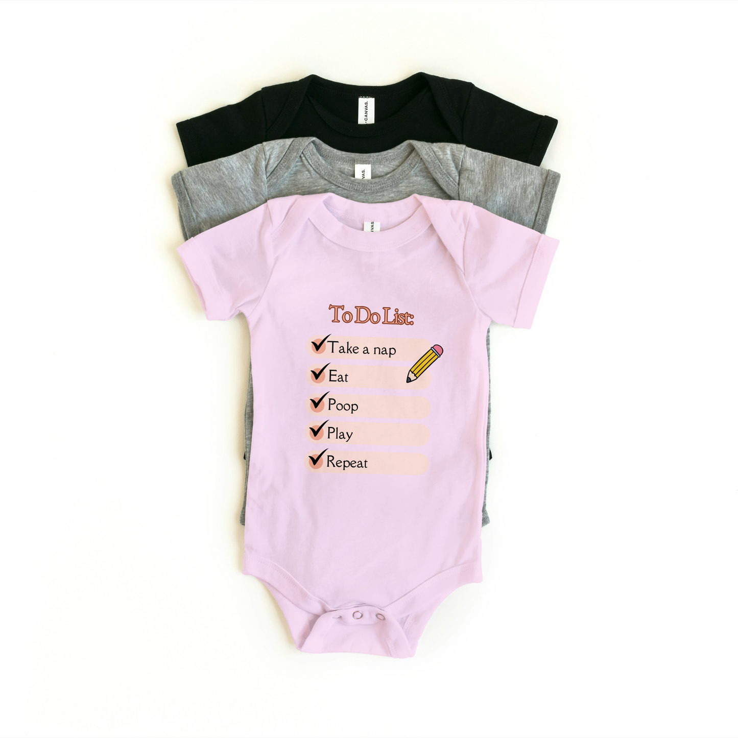 Baby Onesie in pink with to-do list design, perfect for warm weather and easy diaper changes.