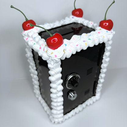 Angled view of black Cake Vault Mini Locker showing frosted design and compact storage size.