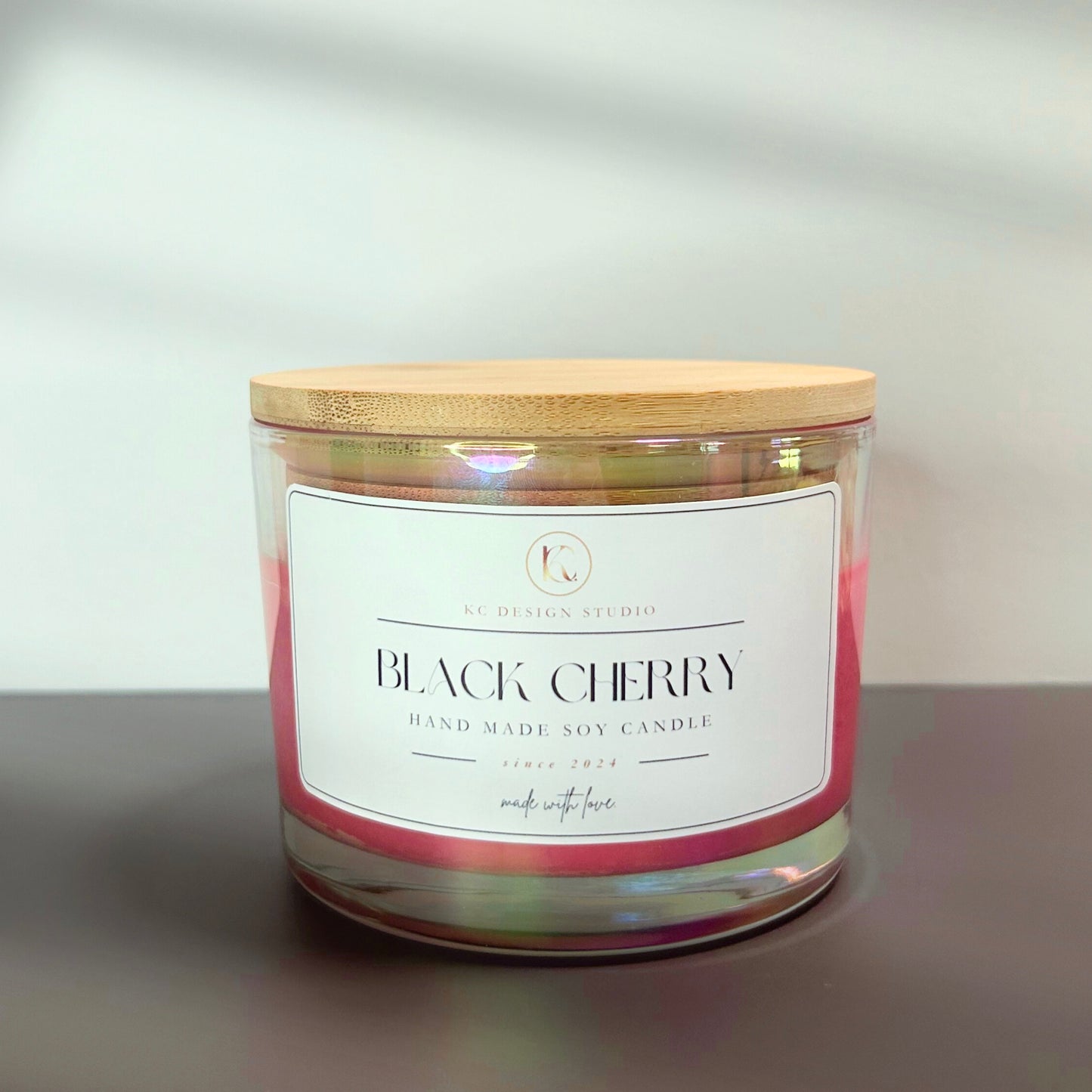 Additional front view of the 16oz Black Cherry candle, emphasizing the rich color, sleek vessel, and luxurious, handcrafted appeal.