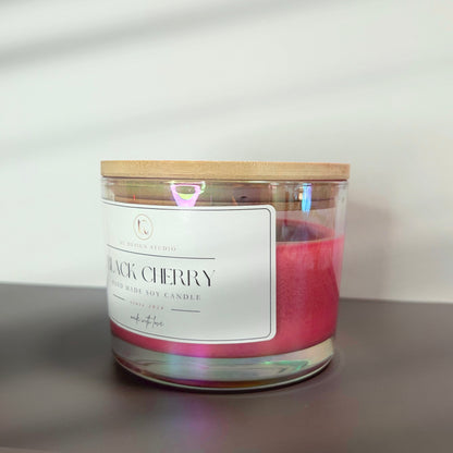 Side view of the 16oz Black Cherry candle, displaying its elegant, burgundy design and sturdy vessel made for a long-lasting burn.