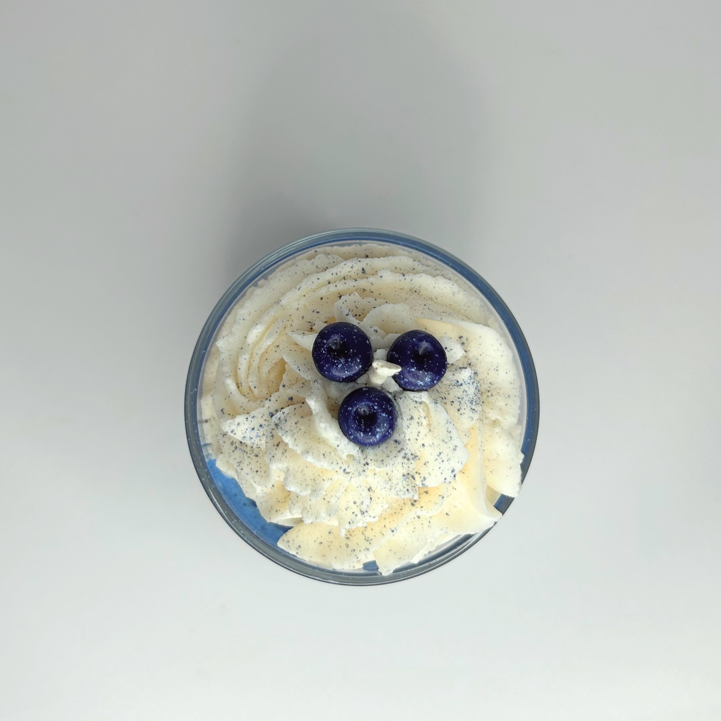 Top view of the Blueberry Milkshake candle, highlighting the smooth surface and vibrant color blend.