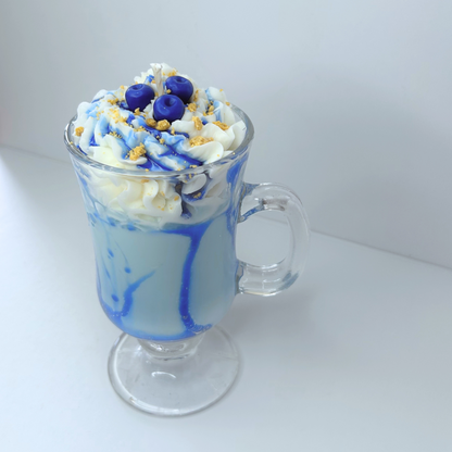 Front view of Blueberry Milkshake Candle with whipped cream topping, blueberry syrup, and realistic dessert details in a glass Irish mug.