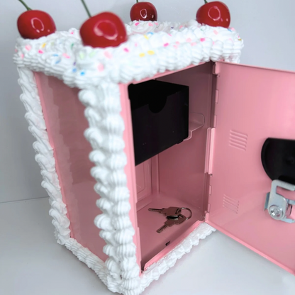 Side angle of Cake Vault mini locker with door open showing inside compartments.