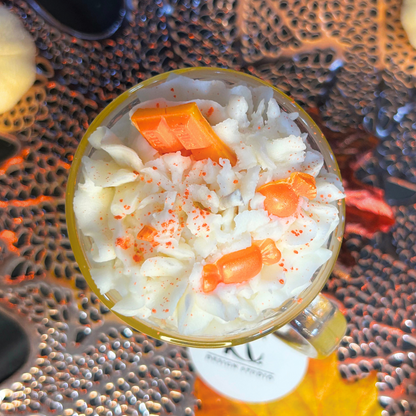 Top view of Candy Corn Candle showing whipped cream design, chocolate bar, and candy topper for a festive Halloween look.