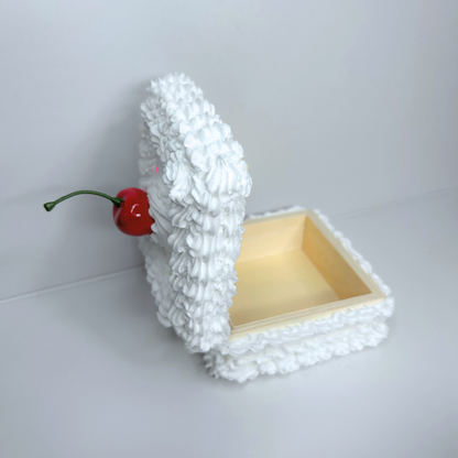 Open cake-inspired wooden storage box showing interior space for small items.