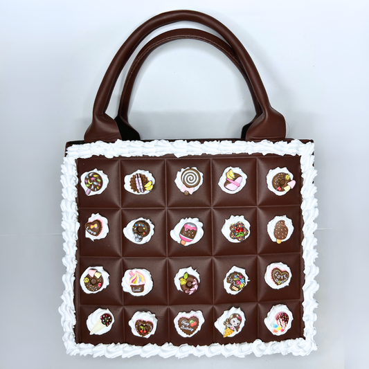 Front view of the Chocolate Bar Purse with frosting outline and kawaii charms.