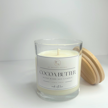 Close-up view of the 10oz Cocoa Butter candle, displaying the smooth surface of the soy wax and the eco-friendly cotton wick.