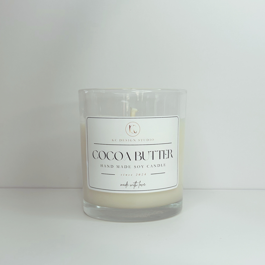 Front view of the 10oz Cocoa Butter candle without a lid, showcasing its elegant design and rich fragrance.