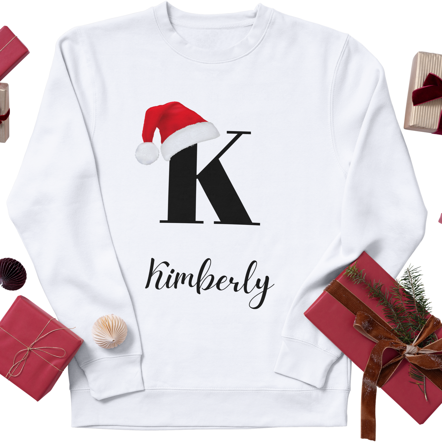 Custom Christmas sweatshirt in white featuring a personalized initial with a Christmas hat and customizable name for a festive, personalized look.