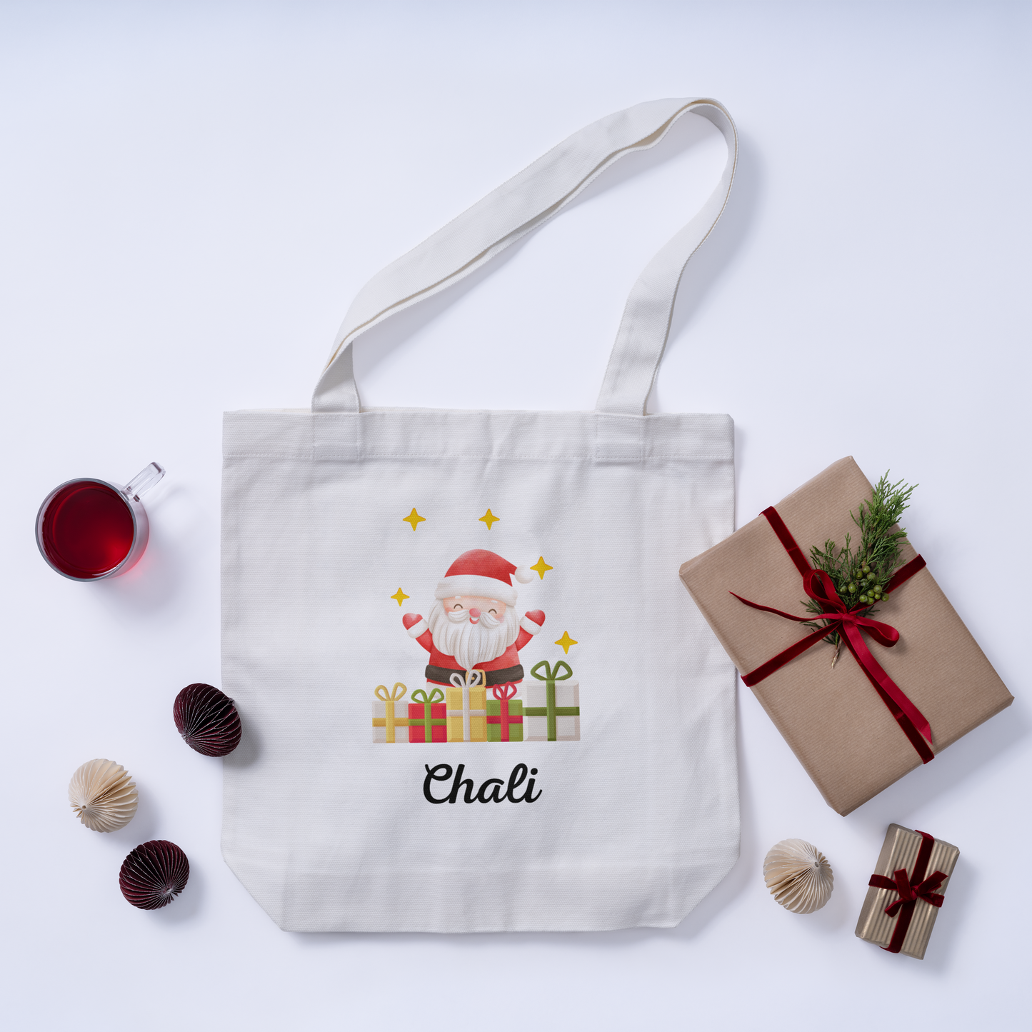 Custom Christmas white tote bag with a Santa Claus design on the initial, and the option to add a personalized name for a cheerful, festive look.