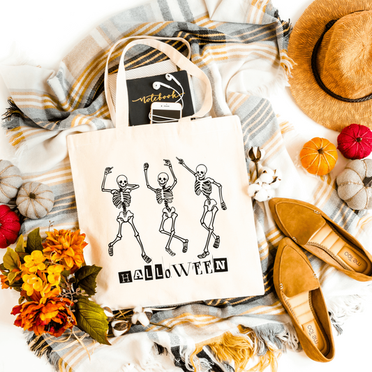 White Dancing Skeleton Halloween tote bag crafted from heavy-duty canvas, ideal for candy hauls and daily use.