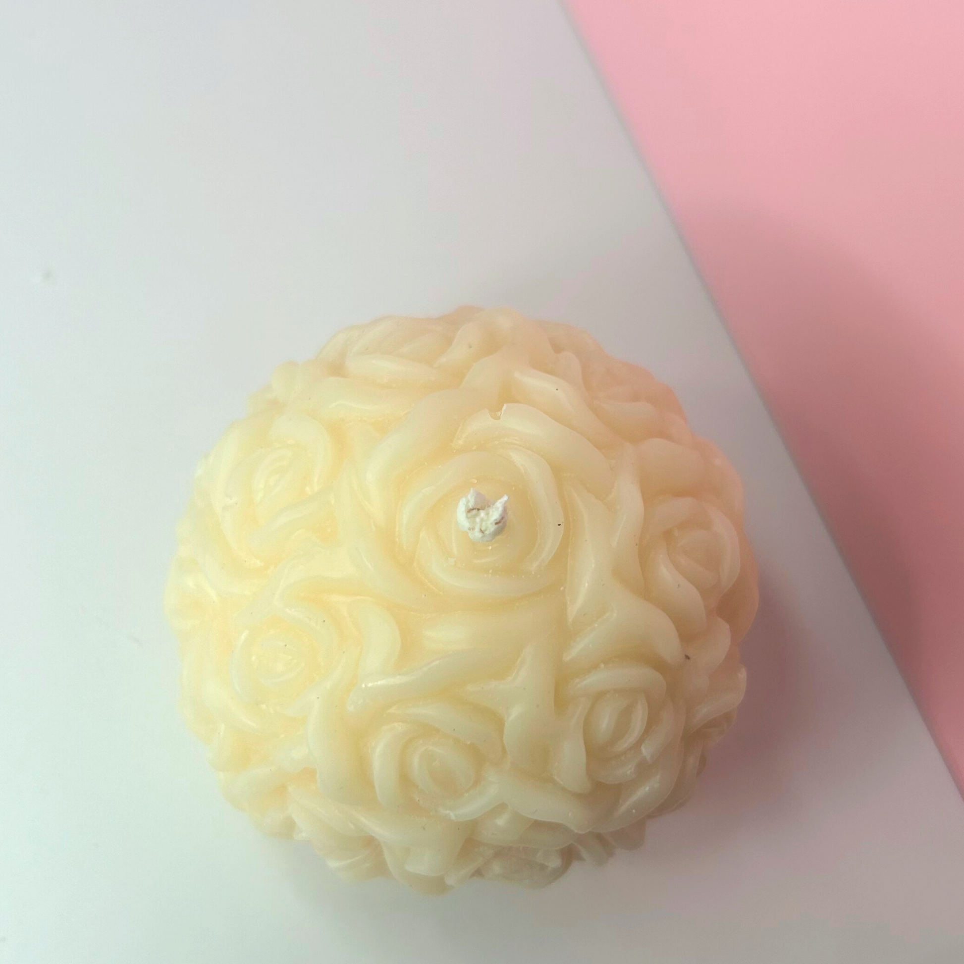 Top view of the Decorative Blossom Breeze Candle, emphasizing its round shape and intricate floral scent profile.