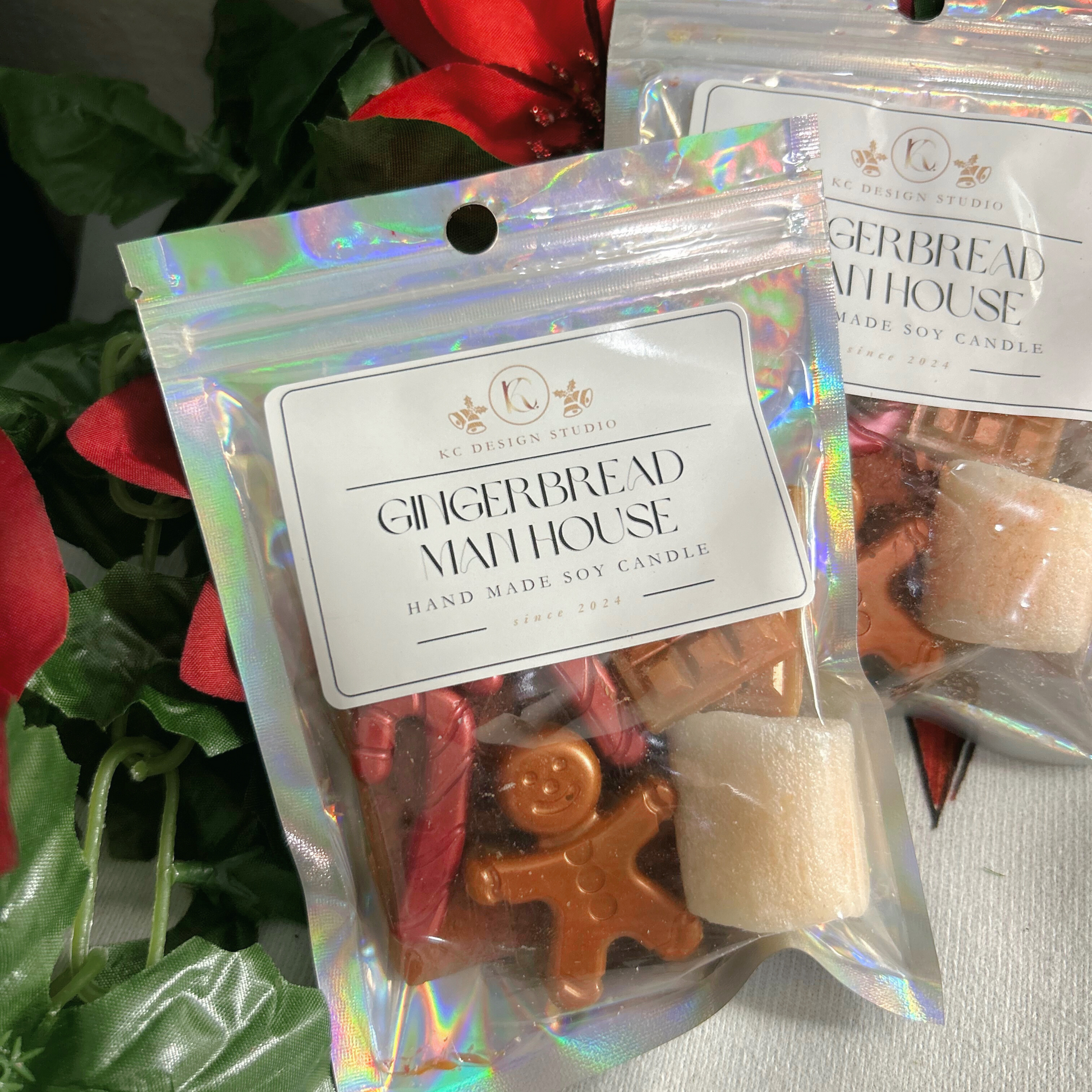 Close-up view of the Gingerbread Man House Wax Melts showcasing intricate details of the gingerbread man, candy canes, marshmallow, and chocolate bars.