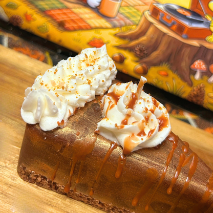 Close-up of the Golden Pumpkin Pie candle showing the detailed crumb texture, golden top layer, whipped cream, crumbs, and syrup finish.