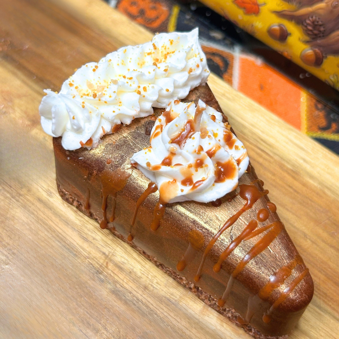 Top view of the Golden Pumpkin Pie candle highlighting the golden pie filling, whipped cream, realistic crumbs, and syrup drizzle.