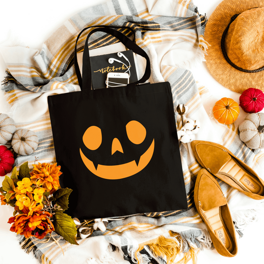 Black Halloween Face Tote, perfect for carrying candy and essentials for trick-or-treating.