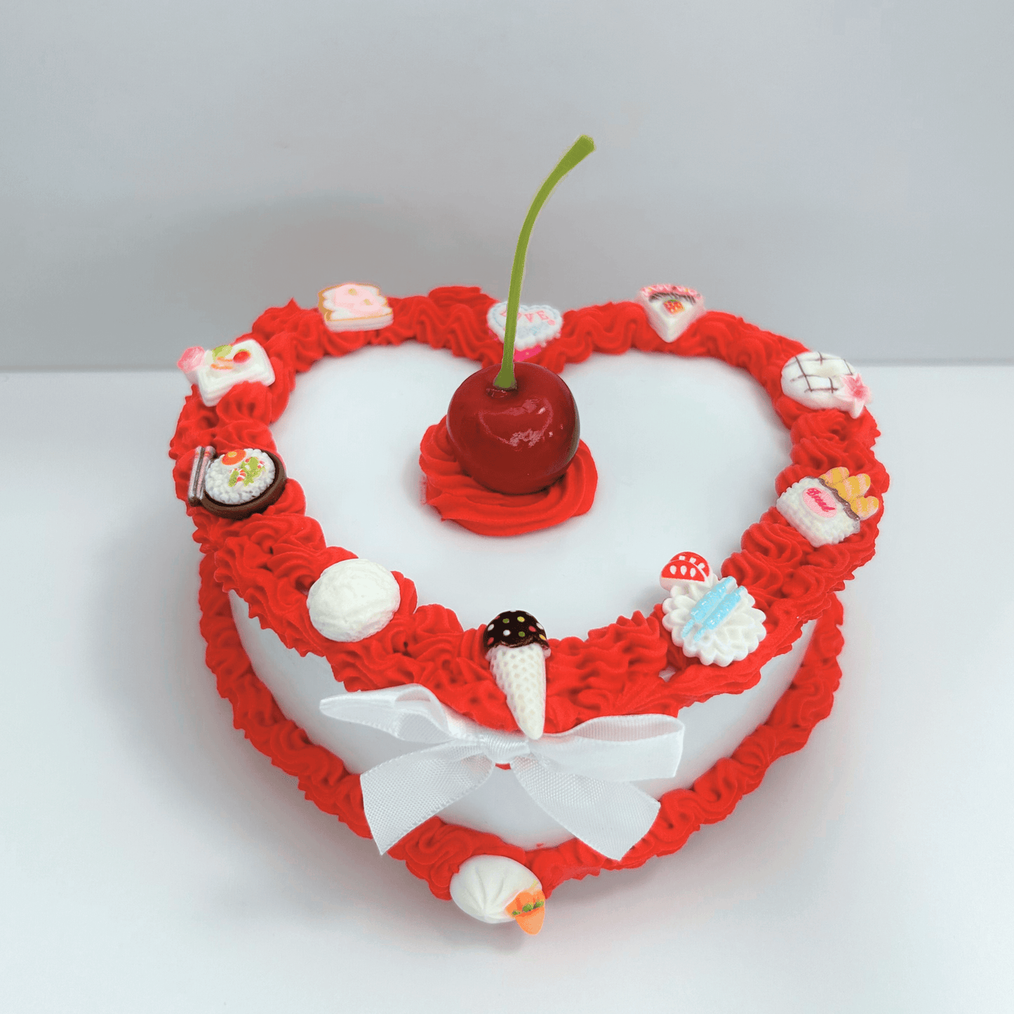 Front view of the vintage-inspired jewelry box showcasing its vibrant red and white colors, heart-shaped design, and charming details.