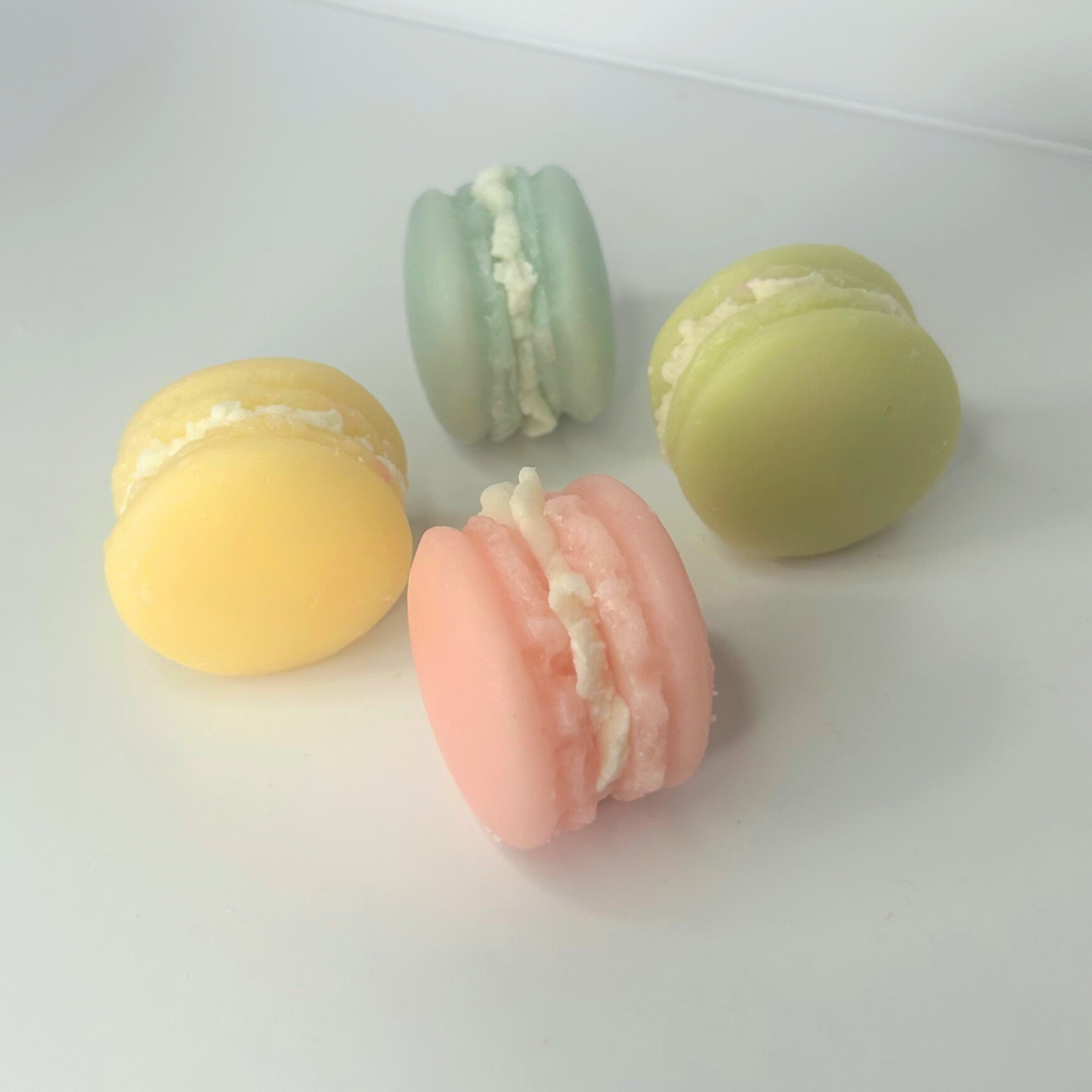 Four Macaroon wax melts standing on their side, showcasing their colorful and sweet design.