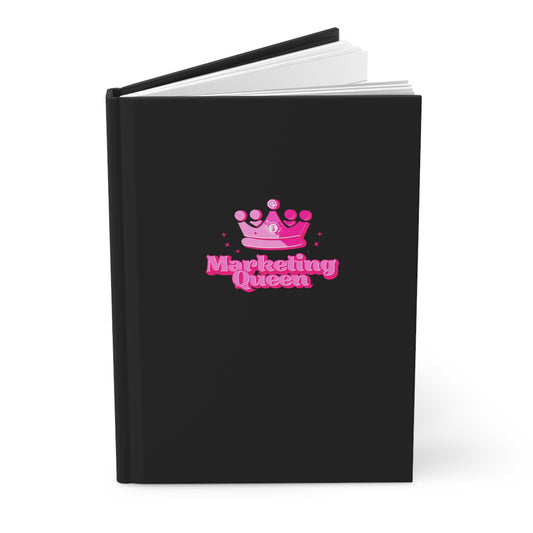 Black notebook with "Marketing Queen" design on a white background.