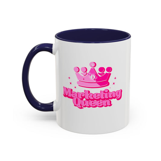 White mug with navy handle and interior, featuring a pink crown and "Marketing Queen" text.