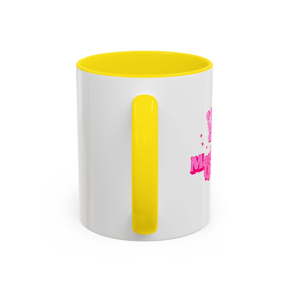 White mug with yellow interior and handle, featuring pink text on a white background