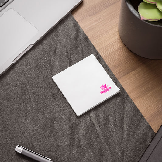 Marketing Queen Post-it Note Pad laying on a desk with bold pink design.